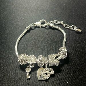 Silver bracelet with charms